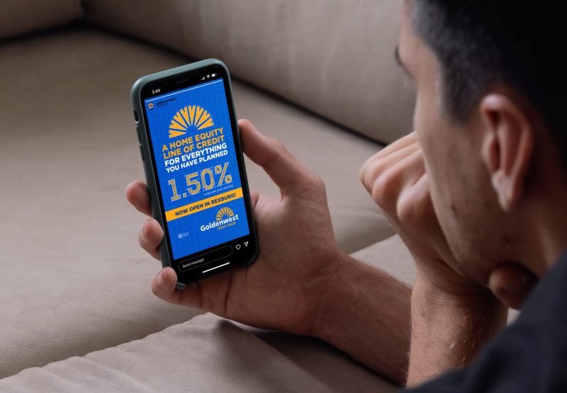 man viewing Golden West Credit Unions website on a mobile phone