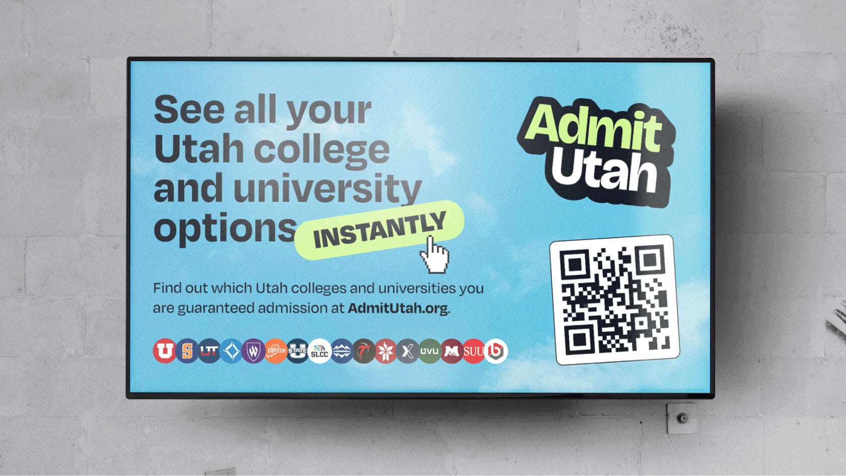 Blue Admit Utah billboard promoting 'See all your Utah college and university options instantly' with a QR code on the right.
